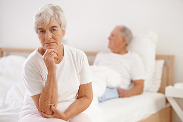 Image showing Senior, couple and sad in bedroom with conflict, ignore and crisis in marriage for mental health or retirement. Elderly, woman or man with fight, argument or divorce on bed in home with disagreement