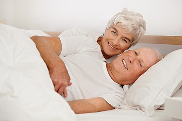 Image showing Senior couple, portrait and relaxing in bed, smiling and love in retirement for bonding on weekend. Elderly people, bedroom and resting or happy in marriage, romance and morning routine at home