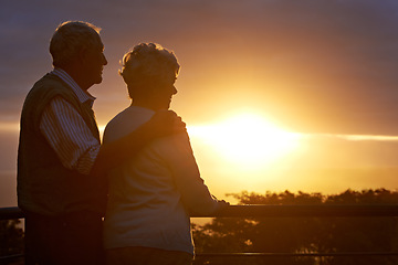 Image showing Senior couple, sunset and relax on balcony in outdoor, bonding and love on vacation or holiday. Retirement, elderly people and dusk on terrace and together in nature, security and travel for marriage