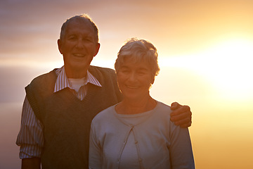 Image showing Portrait, smile and senior couple at sunset for love, romance or retirement bonding outdoor together. Face, autumn or evening with happy elderly man and woman hugging for anniversary or commitment