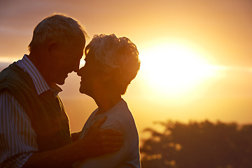 Image showing Sunset, senior couple and embrace in nature, care and bonding for connection together outdoor. Man, woman and nose touch for love, romance and support for commitment to relationship in retirement