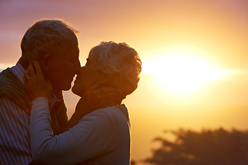 Image showing Sunset, elderly couple or kiss outdoor, care or bonding together for connection in marriage. Man, woman or nose touch for love, romance or embrace for commitment to relationship in retirement on date