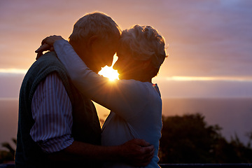 Image showing Sunset, senior couple and embrace outdoor, care and bonding for connection together in nature. Man, woman and touch forehead for love, romance and hug for commitment to relationship in retirement