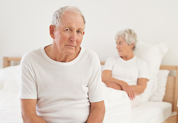 Image showing Elderly, couple and sad in bedroom with conflict, ignore and crisis in marriage for mental health or retirement. Senior, woman or man with fight, argument or divorce on bed in home with disagreement