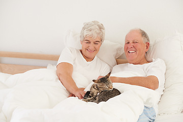 Image showing Senior couple, bed and cat for smile, embrace and love in morning for bonding and cuddle. Mature man, woman and kitty pet, happy and retirement to enjoy marriage and old people in bedroom at home