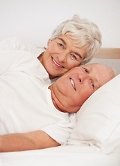 Image showing Senior couple, portrait and together in bed, relaxing and love in retirement for bonding on weekend. Elderly people, bedroom and resting or happy in marriage, romance and morning routine at home