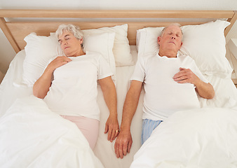 Image showing Sleeping, love and senior couple in bed, resting and relaxing together on weekend in bedroom. Elderly people, retirement and dreaming at home, top view and support in marriage or relationship and nap