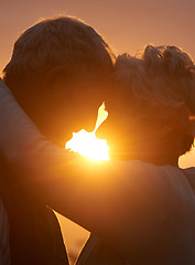 Image showing Sunset, senior couple and embrace outdoor, care and bonding for connection together in nature. Man, woman and touch forehead for love, romance and hug for commitment to relationship in retirement