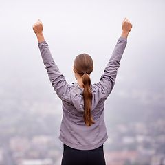 Image showing Fitness, success and victory with woman in mountains for celebration of running goal or target. Exercise, achievement and cheering with back of athlete hands raised in nature for cardio workout