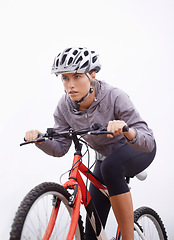 Image showing Athlete, bike and nature with ride, speed and fitness for health and wellness or workout. Woman, cycling and exercise for training, transportation and adventure with helmet and cardio or perseverance