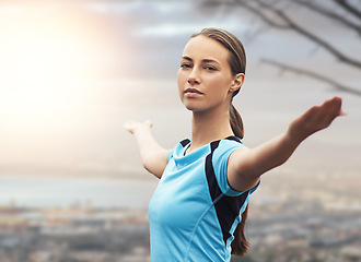 Image showing Portrait, exercise and freedom with sports woman outdoor in mountains for morning cardio training. Fitness, health and running with confident young athlete getting ready for workout in mist