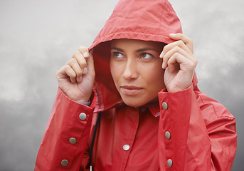 Image showing Woman, rain jacket and hood with weather for cloudy sky, winter season or outdoor storm. Face of female person with red waterproof coat and looking up at rainy overcast for cold, protection or fog