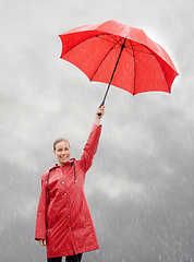 Image showing Woman, portrait and umbrella for security, storm and protection from rain in weather. Female person, insurance and safety or shield from rainfall in outdoor, winter and travel to Scotland for holiday