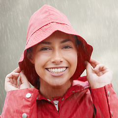 Image showing Woman, portrait and raincoat for protection, outdoor nature and waterproof jacket for rain in weather. Female person, happy and safety or shield from cold, winter and travel to Scotland for holiday