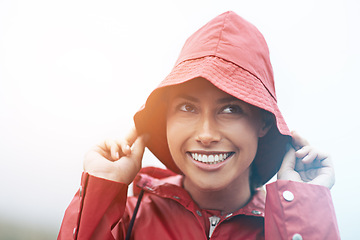Image showing Woman, happy and raincoat for protection, outdoor nature and waterproof jacket for weather or overcast. Female person, smile and safety or shield from cold, winter and travel to Scotland for holiday