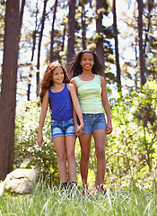 Image showing Happy, exploring and portrait of children in nature for adventure, vacation or holiday together. Smile, travel and full length of girl friends holding hands in outdoor forest, woods or field.