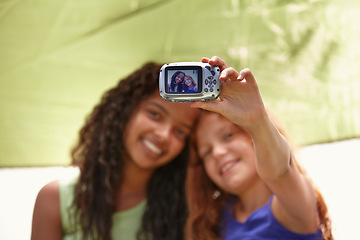 Image showing Happy girl, friends and camera with selfie in tent for memory, camping or photography together. Young female person, child or kids with smile for picture, photo or social media in relax or friendship