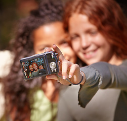 Image showing Happy girl, friends and selfie with camera in nature for memory or outdoor photography together. Young female person, child or kid with smile for picture, photo or social media in relax or friendship