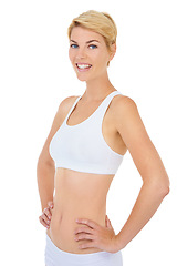 Image showing Woman, portrait and fitness with smile for workout, happy in sportswear for health and wellness on white background. Training, sports and athlete ready for gym and physical activity in studio