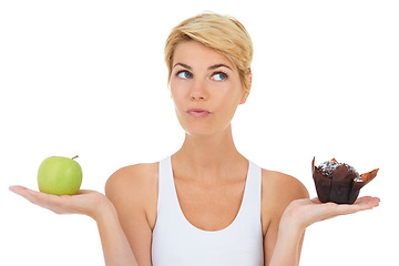 Image showing Woman, fitness and health for diet option, nutrition and decision by studio for lifestyle. Female person, athlete and decide for food, workout and white background with apple and cake choice