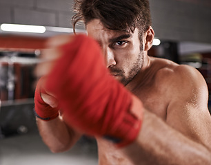 Image showing Man, fist and ready for fighting in gym, fitness and topless for exercise and workout. Male person, bodybuilder and punching for challenge or practice, training and martial arts for competition