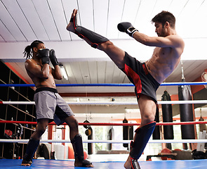 Image showing Kickboxing, fight and men training for exercise and sport in gym, coach and athlete with workout and action. Energy, challenge and MMA with athlete together in ring for boxing, fitness and endurance