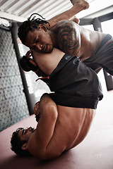 Image showing Fight, wrestling and men sparring in gym for kickboxing competition, challenge and fitness with sports in cage. Match, strong fighter and resilience in exercise, practice and power in battle together