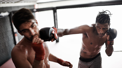 Image showing Punch, pain and men sparring for kickboxing competition, challenge and fitness with fight sports in gym. Boxing match, strong fighter and knockout with exercise, practice and power in battle together