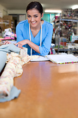 Image showing Happy, woman and portrait of tailor with fabric and planning for fashion, boutique and creative small business. Designer, startup and notebook at store, workshop or seamstress at table with smile