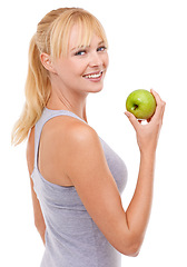 Image showing Portrait, smile and woman with apple for diet, benefits or food to lose weight in studio. Healthy eating, nutrition and happy face of girl with fruit for body wellness, digestion and white background