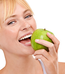 Image showing Portrait, nutrition and happy woman with apple for diet, benefits or food to lose weight in studio. Healthy eating, smile and face of girl with fruit for body wellness, digestion and white background