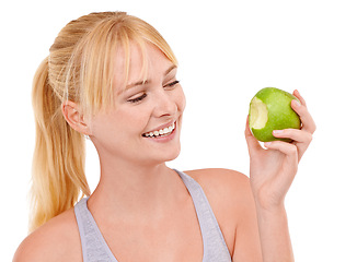 Image showing Bite, smile and woman with apple for diet, benefits or food to lose weight in studio. Healthy eating, nutrition and happy face of girl with fruit for body wellness, digestion and white background