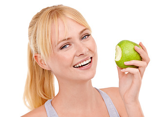 Image showing Portrait, smile and woman with apple for nutrition, benefits or food to lose weight in studio. Healthy eating, diet and happy face of girl with fruit for body wellness, digestion and white background