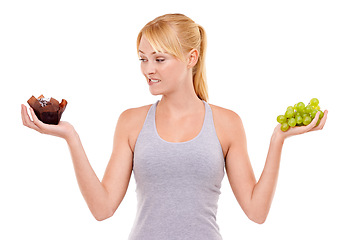 Image showing Portrait, confused and woman with choice of fruit, cake or healthy food to lose weight in studio. Decision, face and girl with grapes vs chocolate dessert for diet, nutrition and white background.