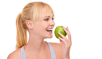 Image showing Face, smile and woman with apple for diet, benefits or food to lose weight in studio. Healthy eating, nutrition and happy girl with fruit for body wellness, digestion and thinking on white background