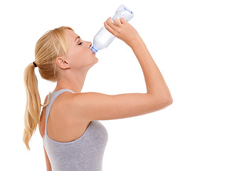 Image showing Drinking water, fitness and woman with wellness, workout and athlete isolated on a white studio background. Person, mockup space and model with a bottle and liquid with nutrition and diet with health