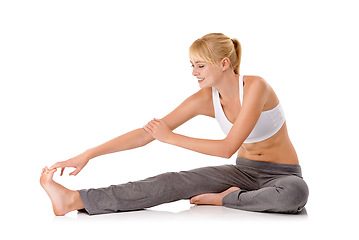 Image showing Woman, legs and stretching in studio for yoga flexibility or practice for workout warm up, wellness or white background. Female person, arm and foot for mobility training, pilates or mockup space