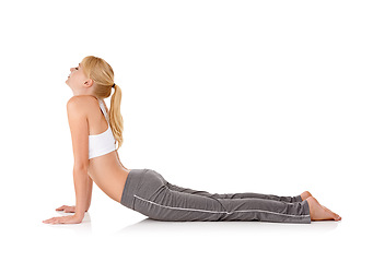 Image showing Woman, yoga and stretching on floor in studio for exercise, healthy body and wellness with fitness and mockup space. Pilates, person and warm up with sportswear for flexibility on white background