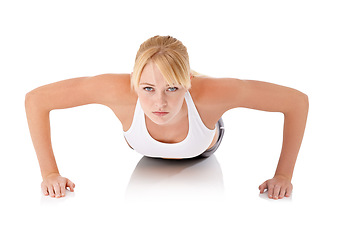 Image showing Studio, workout and portrait of woman with push up for fitness, training or core exercise. Female person, sport and face with serious expression for confident, strength and muscle on white background