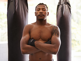 Image showing Fitness, boxing and portrait of black man in gym for challenge, arms crossed and competition training. Power, muscle and serious face of champion boxer at workout with confidence in sports club.