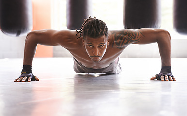 Image showing Portrait, exercise and push up with black man on floor of gym for training strong muscles or power. Fitness, health and body with confident young athlete in workout to improve physical wellness