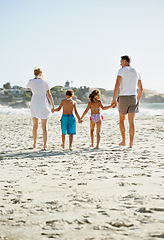Image showing Parents, children and hand holding on beach for holiday together at ocean for connection, bonding or travel. Man, woman and siblings with back view at sea in Florida for vacation, outdoor or journey