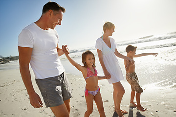 Image showing Parents, children and holding hands on beach or relax vacation at seaside or holiday, bonding or connection. Mother, father and siblings in Florida for travel together or island, paradise or rest