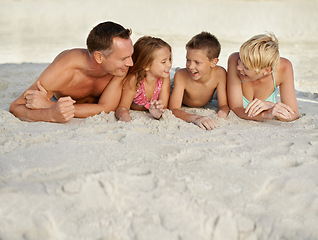 Image showing Family, kids and beach with adventure in summer on vacation for bonding and happiness in Florida. Parents, smile and travel for holiday with children to relax, fun and enjoy trip in seaside.