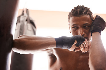 Image showing Fitness, shirtless and elbow with black man kickboxing in gym for health, power or combat sports training. Exercise, mma or self defense and young fighter athlete with punching bag for workout