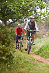 Image showing Cycling, fitness and sports friends in nature for marathon, race and journey with competition or training on path. People or cyclist on bicycle in woods, forest or mountains for exercise and cardio