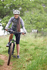 Image showing Happy woman, portrait and cyclist with bicycle in nature for off road travel, trail or extreme outdoor sports. Female person, rider or biker with smile in forest for fitness, workout or exercise