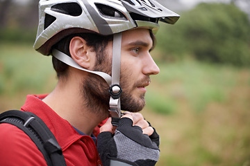 Image showing Cycling, man and health with helmet for safety, protection and exercise gear to travel outdoor. Bicyclist, person and workout in preparation for training, sports or closeup for fitness in profile