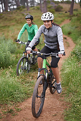 Image showing Happy woman, portrait and friends with bicycle for fitness, cycling or off road travel on trail in nature. Female person, rider or biker with smile in forest for workout or outdoor sports exercise