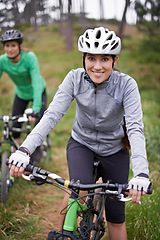 Image showing Happy woman, portrait and friends with bicycle in nature for fitness, cycling or off road travel on trail. Female person, rider or biker with smile in forest for outdoor workout or sports exercise